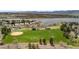 Aerial view of a community with well-maintained green spaces, baseball field, soccer field and a lake nearby at 2032 W Nantucket Ct, Littleton, CO 80120