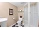 Bathroom featuring a corner shower, tile flooring and a stylish sink at 2032 W Nantucket Ct, Littleton, CO 80120