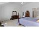 Bright bedroom with carpet, en-suite, and large dresser with mirror for ample storage at 2032 W Nantucket Ct, Littleton, CO 80120