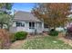 Charming home exterior with a manicured lawn and a private patio area at 2032 W Nantucket Ct, Littleton, CO 80120