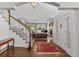 Elegant foyer showcasing hardwood floors, staircase, and a view of the living room at 2032 W Nantucket Ct, Littleton, CO 80120