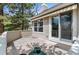 Secluded patio with sliding glass doors and an awning for added privacy at 2032 W Nantucket Ct, Littleton, CO 80120