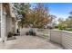 Charming patio with a white fence, greenery and space for outdoor seating at 2032 W Nantucket Ct, Littleton, CO 80120