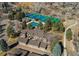 Aerial view of townhomes with community pool, tennis courts, and basketball court at 8109 E Phillips Cir, Centennial, CO 80112