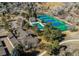 Aerial view of community pool, tennis courts, and adjacent residential properties at 8109 E Phillips Cir, Centennial, CO 80112