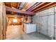 Unfinished basement with washer and dryer hookups and exposed ceiling at 8109 E Phillips Cir, Centennial, CO 80112