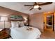 Inviting bedroom showcasing a ceiling fan, soft lighting, and calming decor for peaceful nights at 8109 E Phillips Cir, Centennial, CO 80112