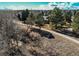 Tranquil creek and walking path surrounded by mature trees and natural landscape at 8109 E Phillips Cir, Centennial, CO 80112