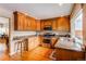 Bright kitchen featuring wooden cabinets, granite countertops, and stainless steel appliances at 8109 E Phillips Cir, Centennial, CO 80112