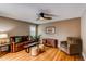 Living room featuring hardwood floors, comfortable seating, and natural light at 8109 E Phillips Cir, Centennial, CO 80112