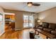 Living room featuring hardwood floors and sliding glass doors to the backyard at 8109 E Phillips Cir, Centennial, CO 80112