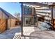 Backyard patio area with a pergola, outdoor furniture, and privacy fence at 8109 E Phillips Cir, Centennial, CO 80112