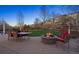 Stone firepit, outdoor dining, and a scenic backyard make for a great place to spend an evening at 2090 Bellavista St, Castle Rock, CO 80109