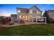 Backyard with patio, fire pit, pergola, hot tub, and lush lawn at 2090 Bellavista St, Castle Rock, CO 80109
