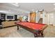Spacious basement featuring a pool table and a stylish barn door at 2090 Bellavista St, Castle Rock, CO 80109