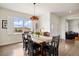 Bright dining room with large windows offering scenic views and stylish furnishings at 2090 Bellavista St, Castle Rock, CO 80109