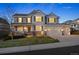 Charming two-story home featuring a manicured lawn, attached two-car garage, and well-maintained landscaping at 2090 Bellavista St, Castle Rock, CO 80109