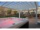 Backyard includes a hot tub under a pergola and an outdoor dining area at 2090 Bellavista St, Castle Rock, CO 80109