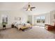 Serene main bedroom with vaulted ceilings, neutral tones, and large windows at 2090 Bellavista St, Castle Rock, CO 80109