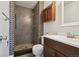 Bathroom with walk-in shower, decorative tile, and a modern vanity at 16622 E Asbury Ave, Aurora, CO 80013