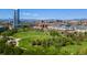 Aerial view of the cityscape with a green park and mountain backdrop at 1700 Bassett St # 1014, Denver, CO 80202