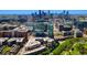 Vibrant aerial view of modern apartment buildings with a city skyline backdrop at 1700 Bassett St # 1014, Denver, CO 80202