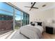 Bright bedroom offering floor-to-ceiling windows and city views at 1700 Bassett St # 1014, Denver, CO 80202