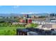 Scenic city view with snow-capped mountains in the distance and lush green trees at 1700 Bassett St # 1014, Denver, CO 80202