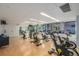 Bright and airy gym with stationary bikes, mirrors, and large windows offering natural light and city views at 1700 Bassett St # 1014, Denver, CO 80202
