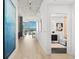 Hallway featuring contemporary decor, leading to a bright living space and modern bathroom at 1700 Bassett St # 1014, Denver, CO 80202