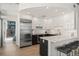 Contemporary kitchen featuring stainless steel appliances, an island, and hardwood floors at 1700 Bassett St # 1014, Denver, CO 80202