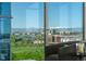 Cozy living room view showcases floor-to-ceiling windows and expansive views of the city skyline at 1700 Bassett St # 1014, Denver, CO 80202