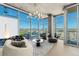 Beautiful living room with modern chandelier, city views, and hardwood floors at 1700 Bassett St # 1014, Denver, CO 80202