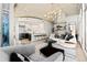 Open-concept living space featuring a modern kitchen, sleek furniture, and contemporary lighting at 1700 Bassett St # 1014, Denver, CO 80202