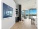 Bright living room with concrete ceilings, hardwood floors, and city views at 1700 Bassett St # 1014, Denver, CO 80202