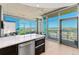 Bright living room with floor-to-ceiling windows, concrete ceilings, and wood floors at 1700 Bassett St # 1014, Denver, CO 80202