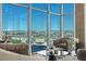 Bright living room with floor-to-ceiling windows offering stunning city and mountain views at 1700 Bassett St # 1014, Denver, CO 80202