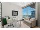 Bright office featuring a glass desk, cityscape view, and a comfortable seating area at 1700 Bassett St # 1014, Denver, CO 80202
