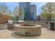 Stylish outdoor patio featuring a stone firepit and stainless steel grills at 1700 Bassett St # 1014, Denver, CO 80202