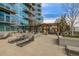 Relaxing outdoor patio space with lounge chairs, pergola, and garden planters at 1700 Bassett St # 1014, Denver, CO 80202