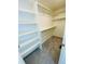 Walk-in closet with carpeted floor, rods, and shelving storage at 45016 Sunflower Ln, Bennett, CO 80102