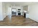 Bright kitchen with white cabinets, granite countertops, and stainless-steel appliances at 45016 Sunflower Ln, Bennett, CO 80102