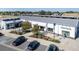 Aerial view of Town Hall featuring parking lot, modern architecture, and landscaping at 45016 Sunflower Ln, Bennett, CO 80102