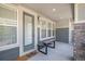 Cozy front porch featuring comfortable seating and a cheerful welcome mat, enhancing curb appeal at 1962 Canyonpoint Ln, Castle Pines, CO 80108