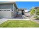 Charming home featuring a well-kept lawn, two-car garage, inviting porch, and tasteful landscaping at 1962 Canyonpoint Ln, Castle Pines, CO 80108