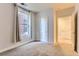 Bedroom with neutral paint, and two closets at 1630 N Clarkson St # 204, Denver, CO 80218