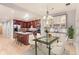 Open kitchen and dining area featuring an island and hardwood floors at 1630 N Clarkson St # 204, Denver, CO 80218