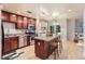 Modern kitchen with stainless appliances, hardwood floors, and center island at 1630 N Clarkson St # 204, Denver, CO 80218