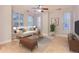 Bright living room with hardwood floors, large windows, and neutral decor at 1630 N Clarkson St # 204, Denver, CO 80218