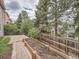Backyard featuring a garden bed, stone patio, and a tall wooden fence for privacy at 19098 E Ida Dr, Aurora, CO 80015
